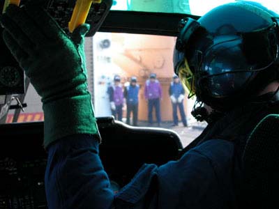 Pilot Scott Weaver completes his preflight checks